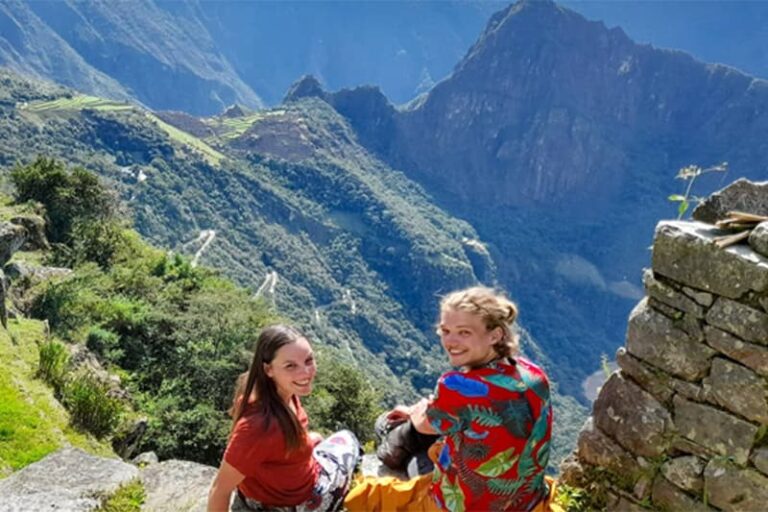 Hikers reaching Sun Gate Machu Picchu Inca Trail 4 Days