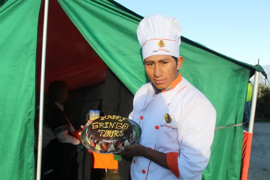 Travelers and chef sharing fresh food on the Inca Trail