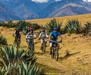 Mountain bikers descending an Andean trail on the Death Road tour from Cusco